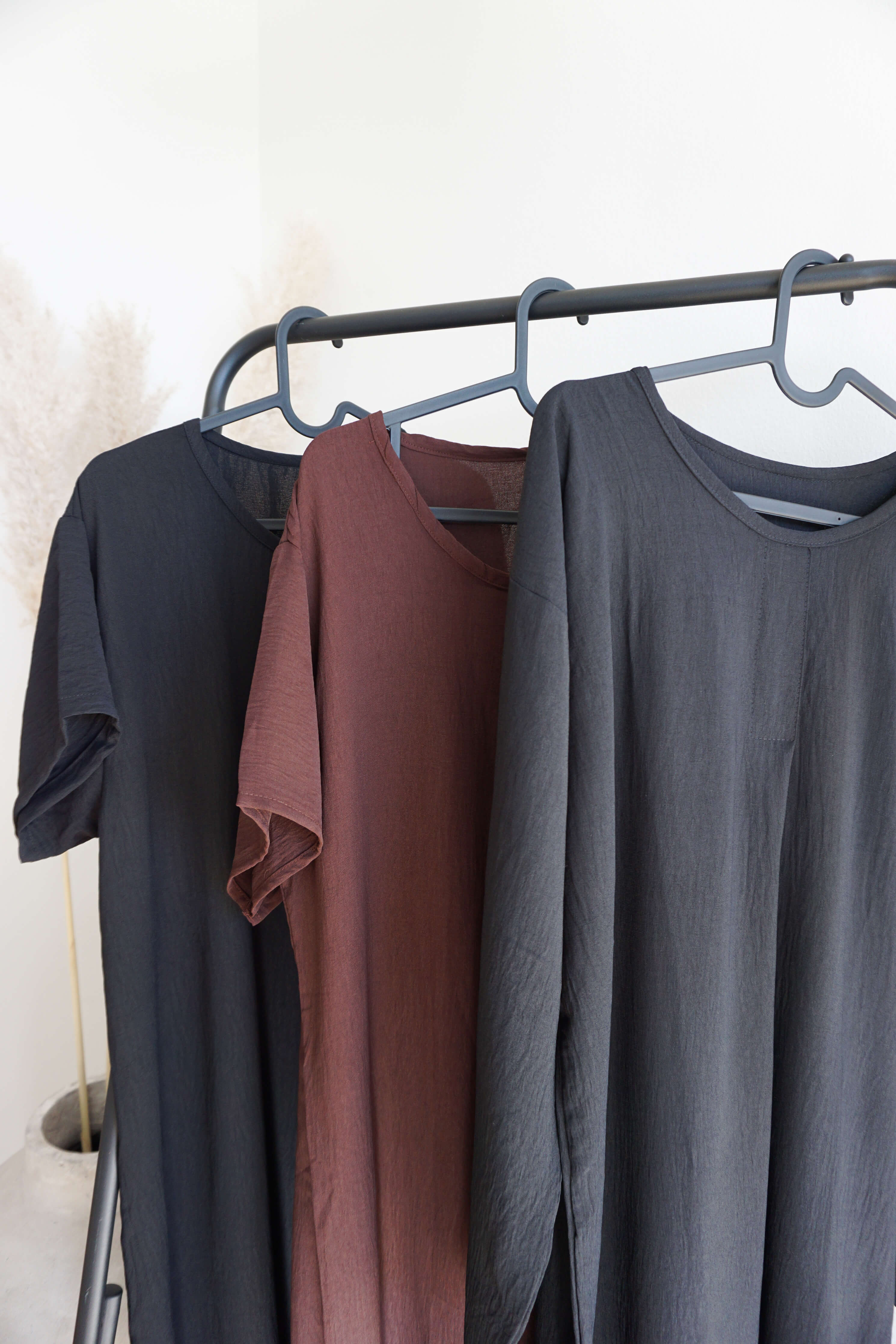 Maxi Dresses in black and dark chocolate on display